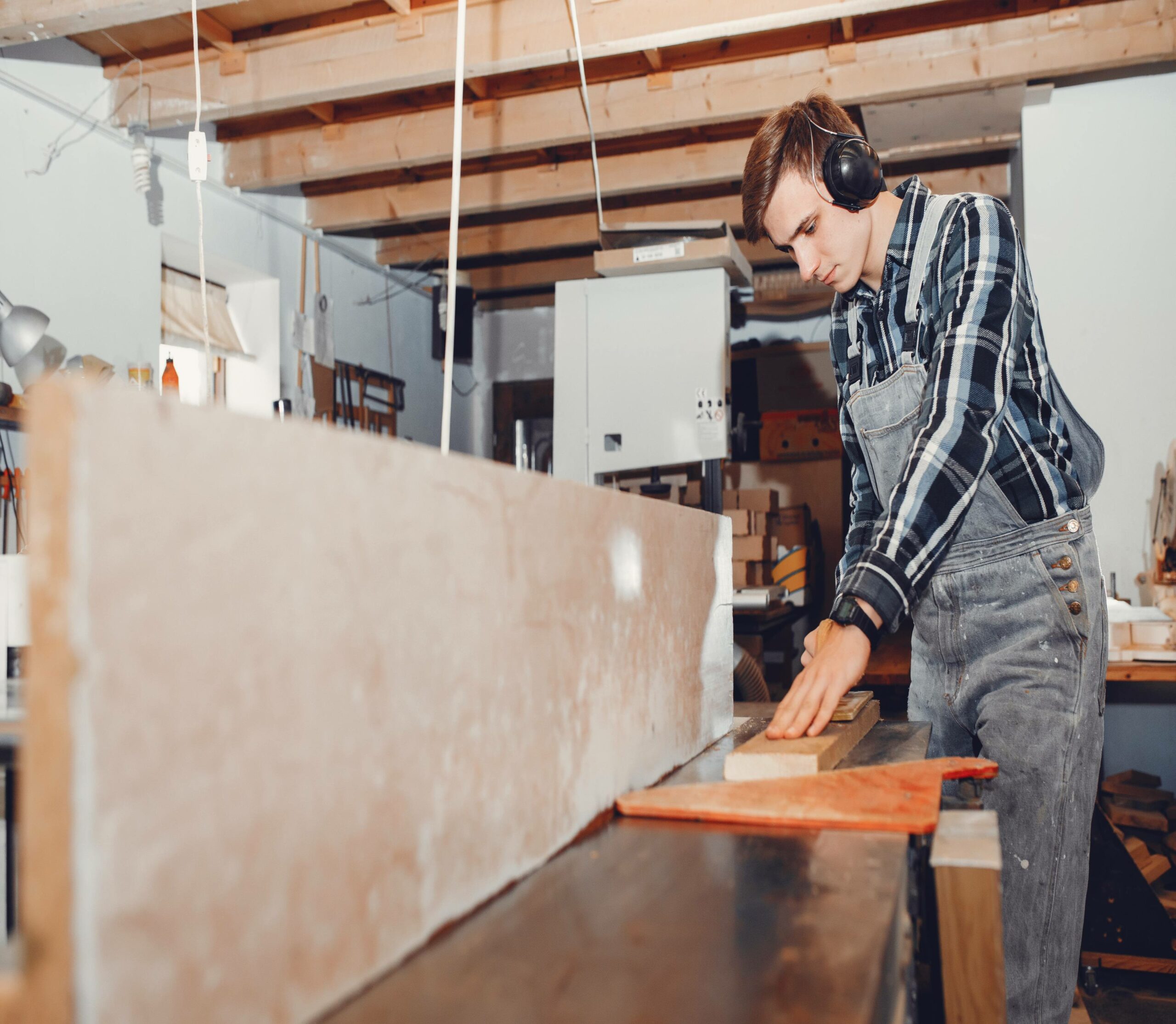 The carpenter works with a tree